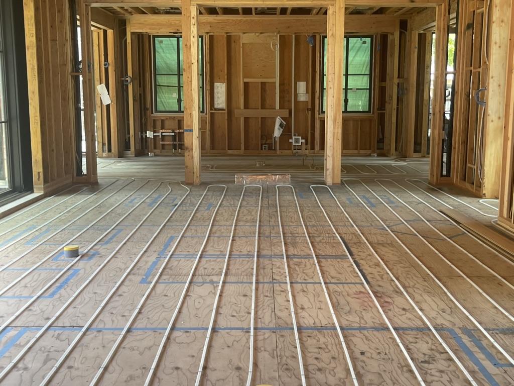 Whole-room radiant PEX layout on wood subfloor
