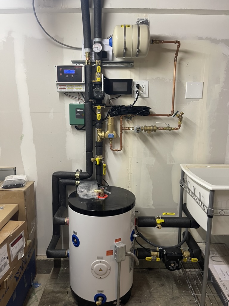Mechanical room with buffer tank and controls