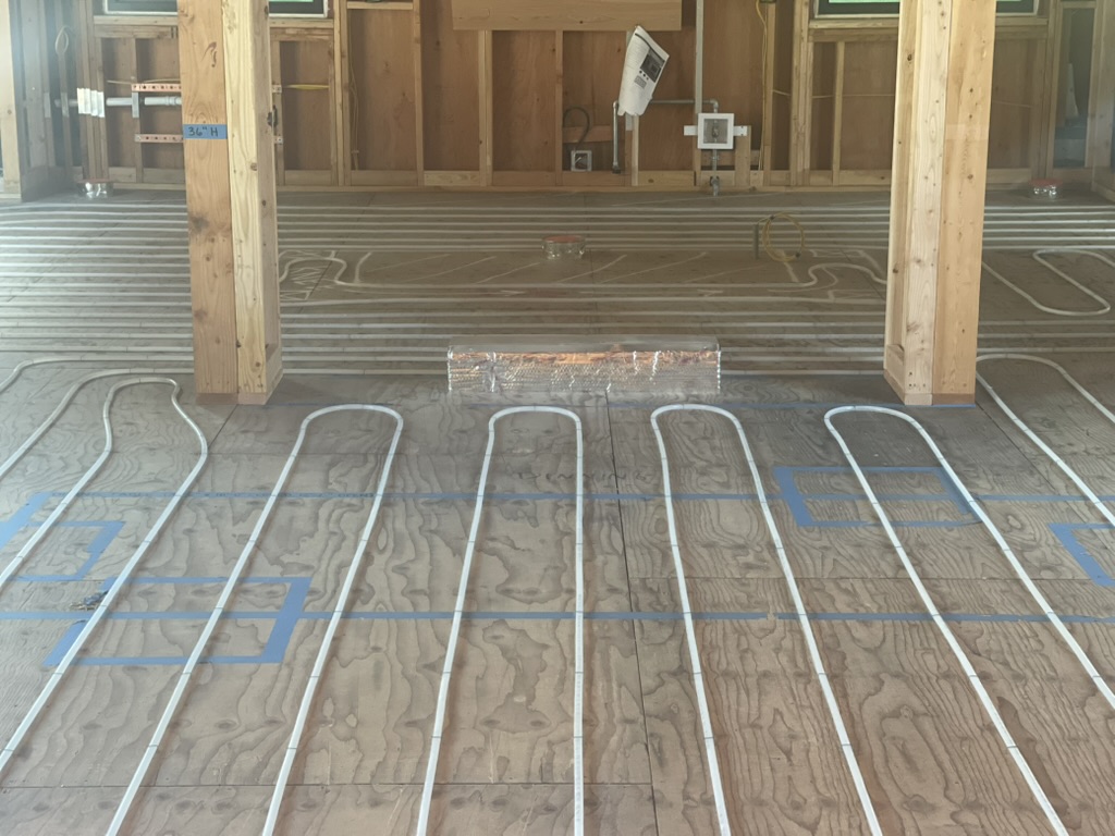 Radiant heating PEX stapled to plywood subfloor