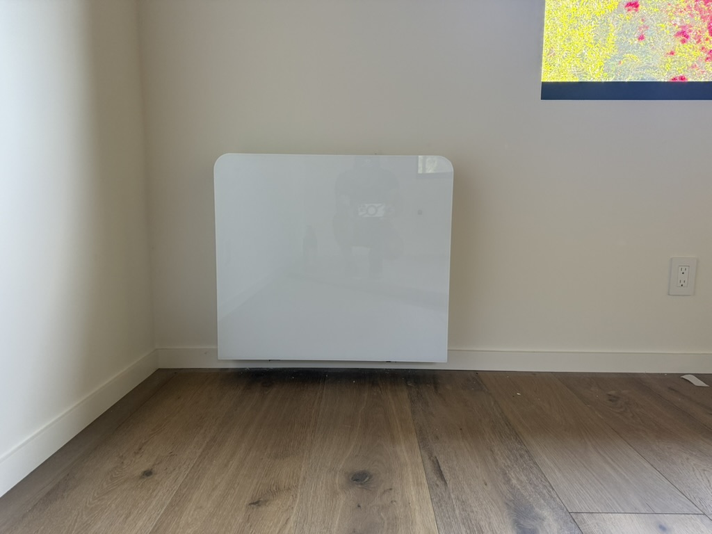 Thin-profile wall-mounted hydronic unit