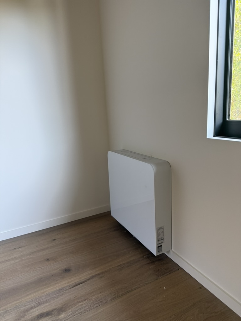 Thin wall-mounted hydronic fan coil