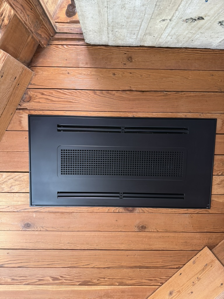Flush ceiling fan coil unit in redwood ceiling